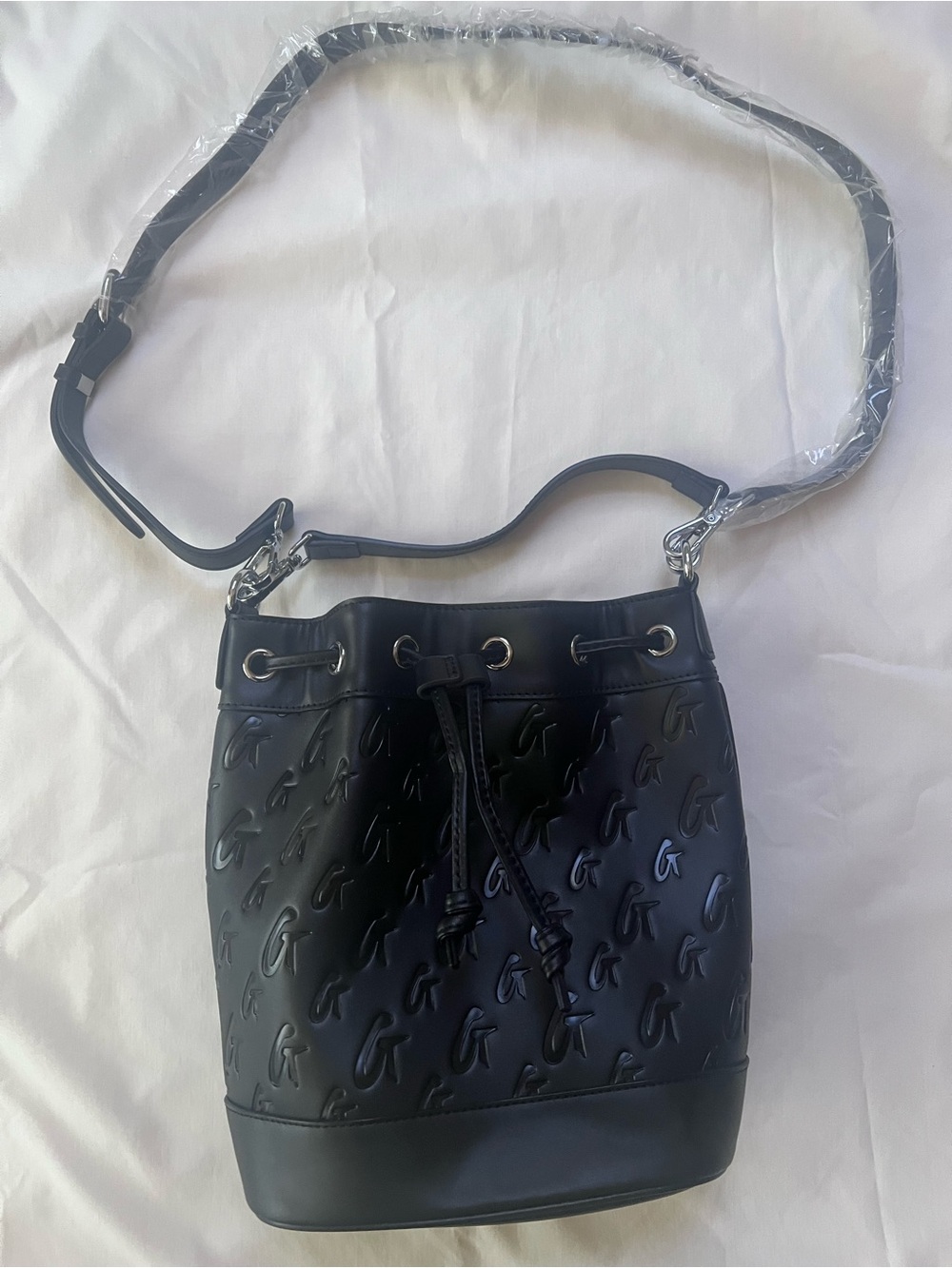 Glam-Aholic Embossed Monogram Black Bucket Bag